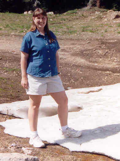 Julie with snow in the mountains