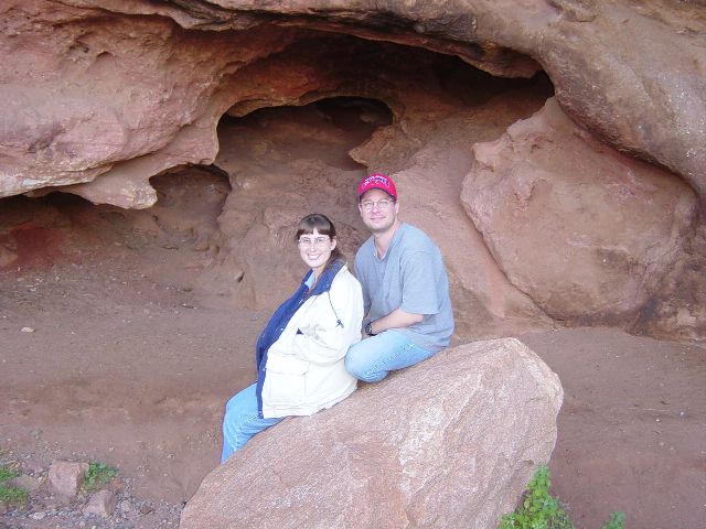 James and Julie posing for photo in hollowed rock formation