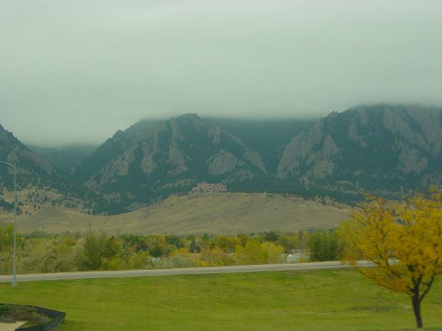 Clouds covering the mountain tops heading out of Denver