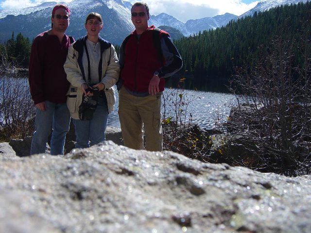 James, Julie, and Eric with Bear Lake with mountains in backgroung
