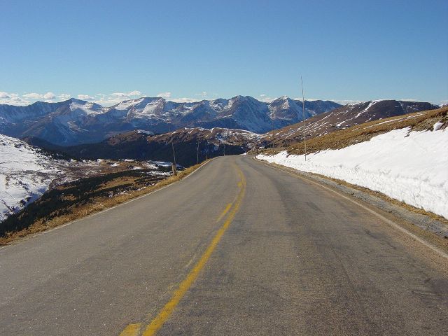 Road descending with mountains beyond