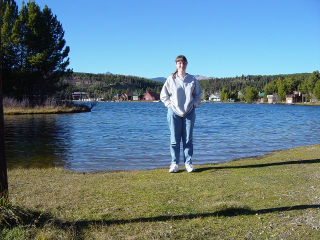 Julie standing at the edge of Grand Lake