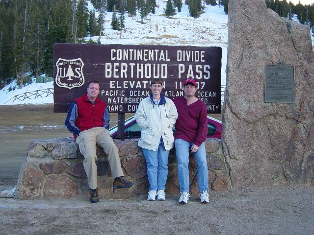 Eric, Julie, and James at the Berthoud Pass Continental Divide sign