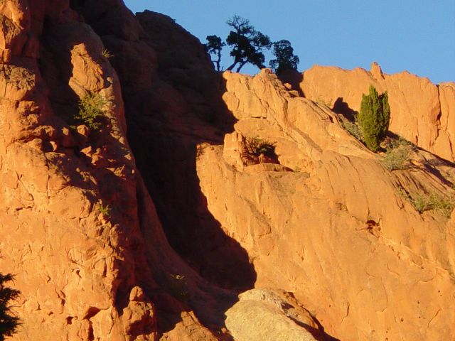 Shadows cast on the red rock formations as sun starts to set