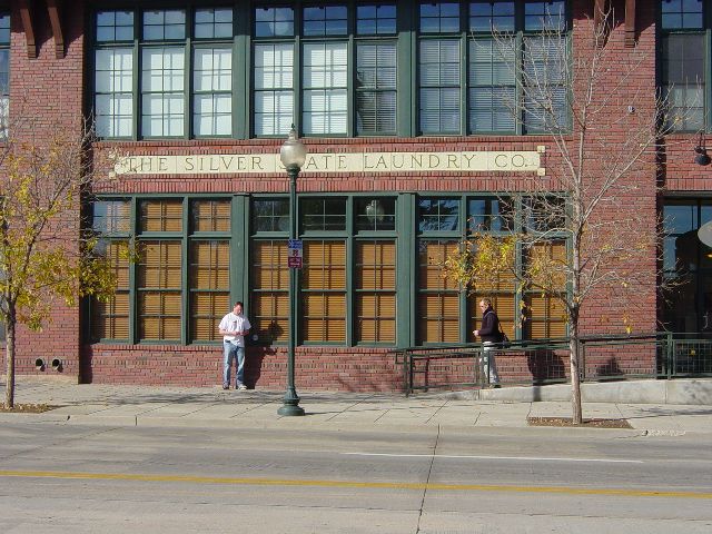 Eric standing outside his condo building