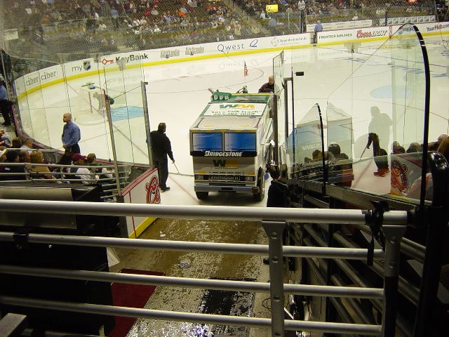 Ice resurfacing equipment leaving the rink after running during an intermission