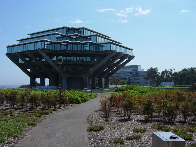 Glass and concrete building roughly shapped like a mushroom