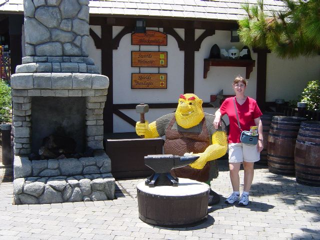 Julie stands next to a LEGO blacksmith only slightly shorter then her