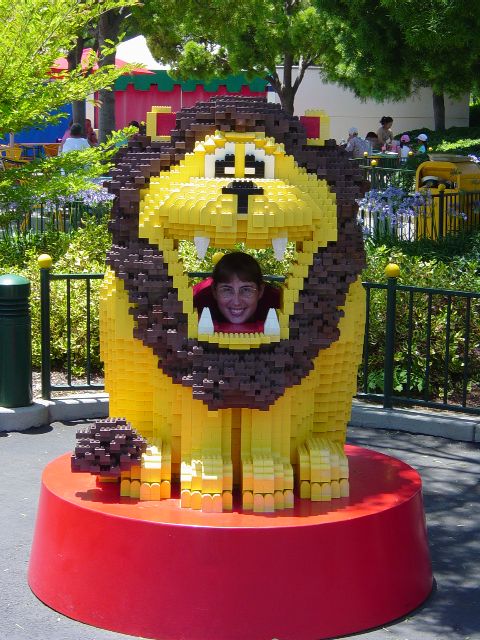 Julie posing in mouth of LEGO lion