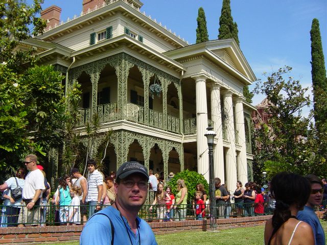 James in line in front of a souther plantation style building