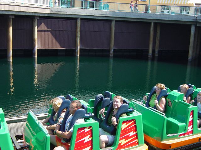 James in a green roller coaster car