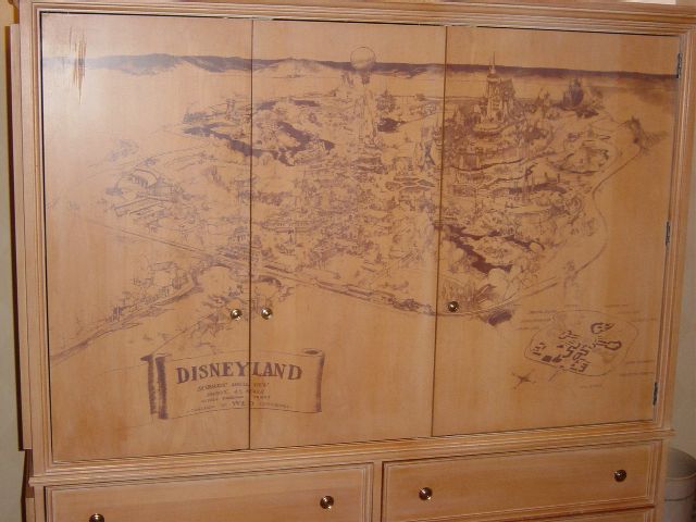Wood cabinet with map of Disneyland Park etched in front