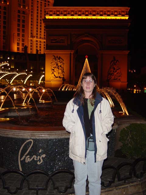 Julie outside the Paris hotel with a reduced scale Arc de Triumph