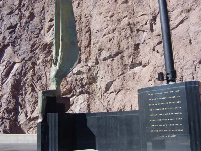 White angel sculpture on black stone monument