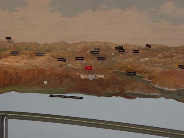 Model of Colorado River with black flag markers
