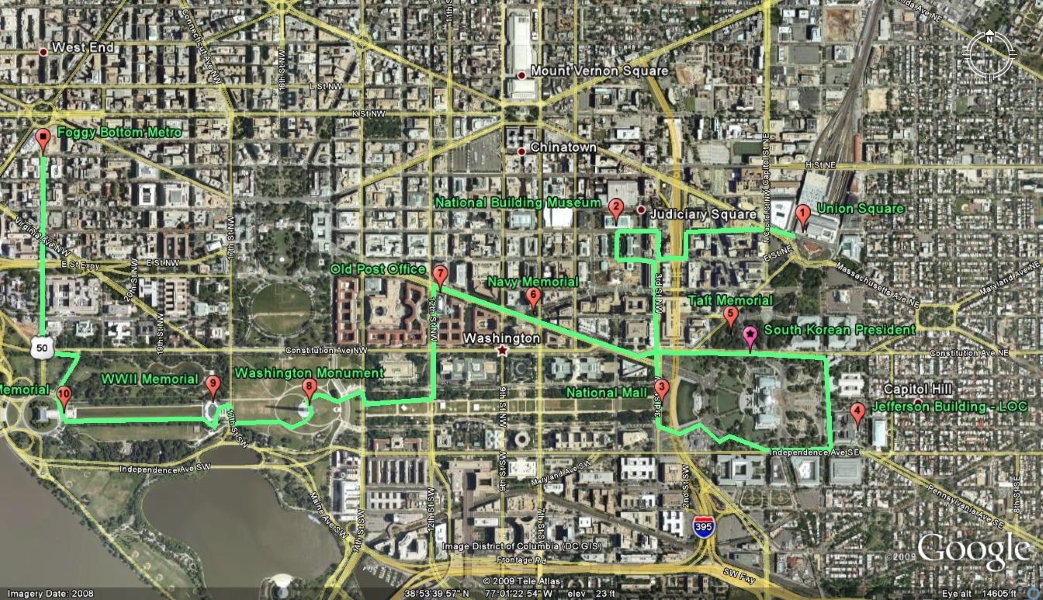 An arial view of the National Mall in Washington, DC with a green line and red markers indicating different sites