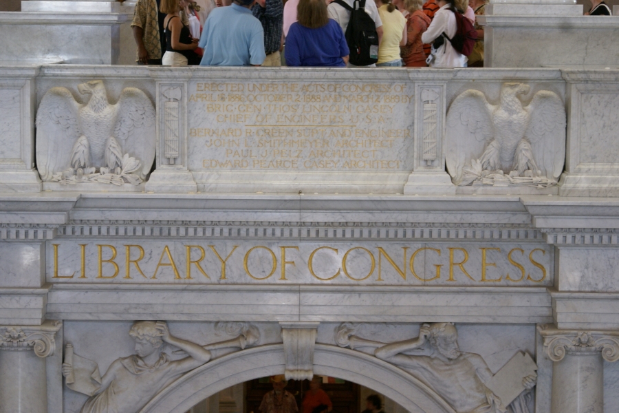 Ornate carvings in marble surround gold inlay and lettering
