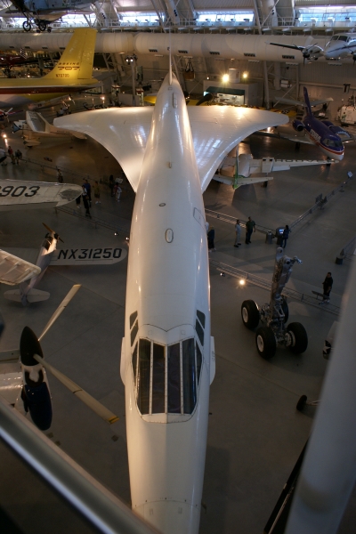 A sleek white plane with narrow fuselage and “V” shaped wings