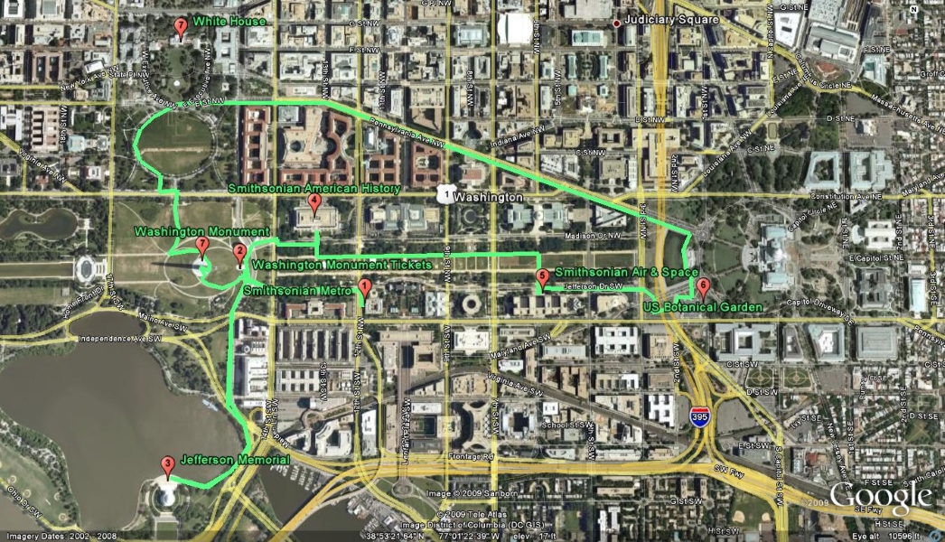 An arial view of the National Mall in Washington, DC with a green line and red markers indicating different sites