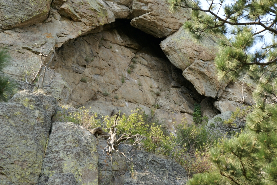 A stone arch shows where rocks have fallen away while the stone core of the tower is still solid beyond