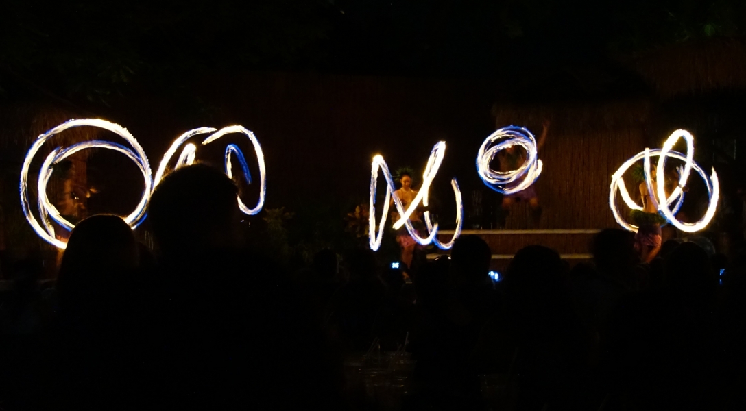 The dark night is illuminated by a mesmerizing dance of fire. Skilled performers wield flaming torches, creating intricate patterns of light in the air.