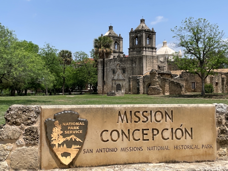 A sign with the National Parks logo reads Mission Concepción