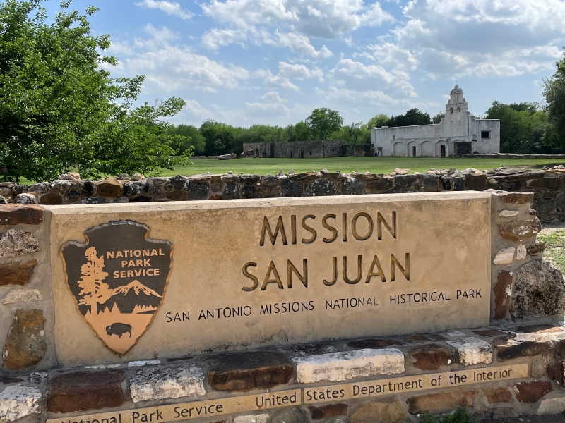 A sign with the National Parks logo reads Mission San Juan