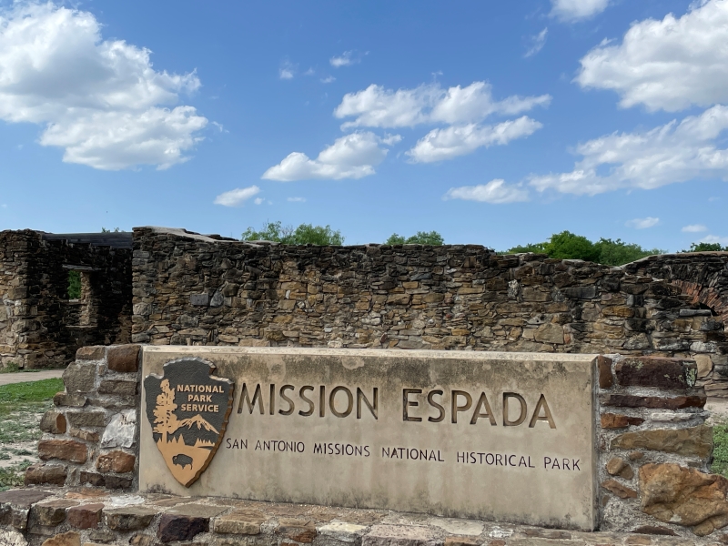 A sign with the National Parks logo reads Mission Espada