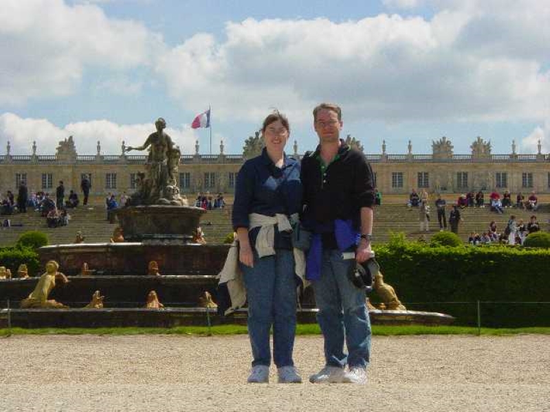Julie and James with one of the fountains and the chateau behind