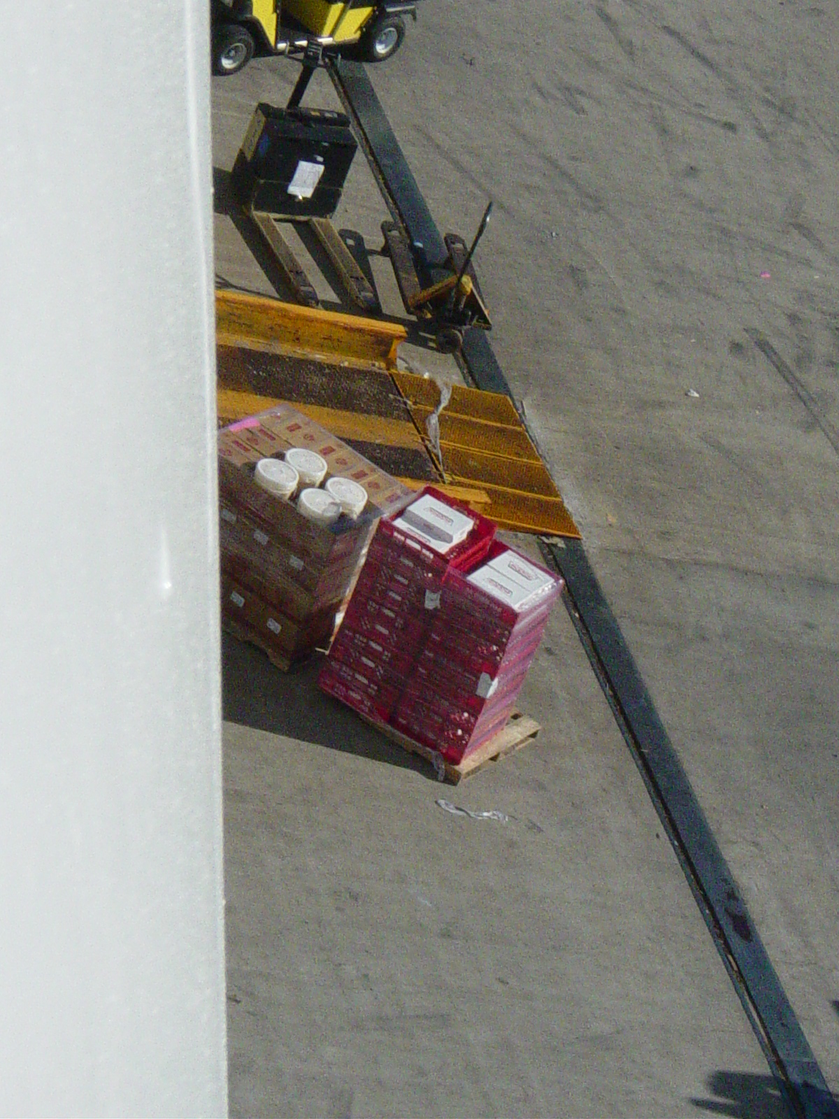 Boxes of Krispy Kreme donuts on a pallet to be loaded on the ship