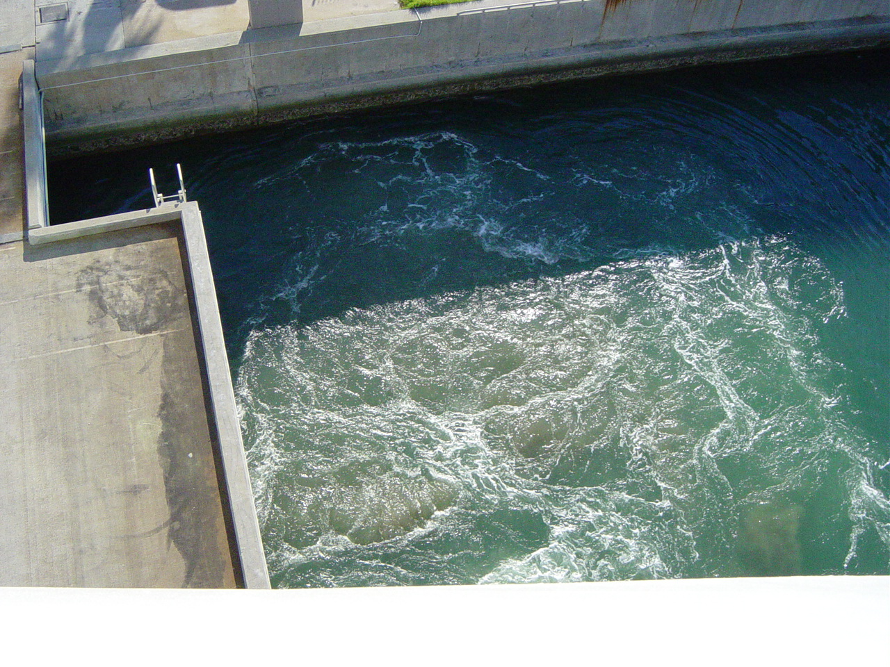 Turbulent water around a concrete dock