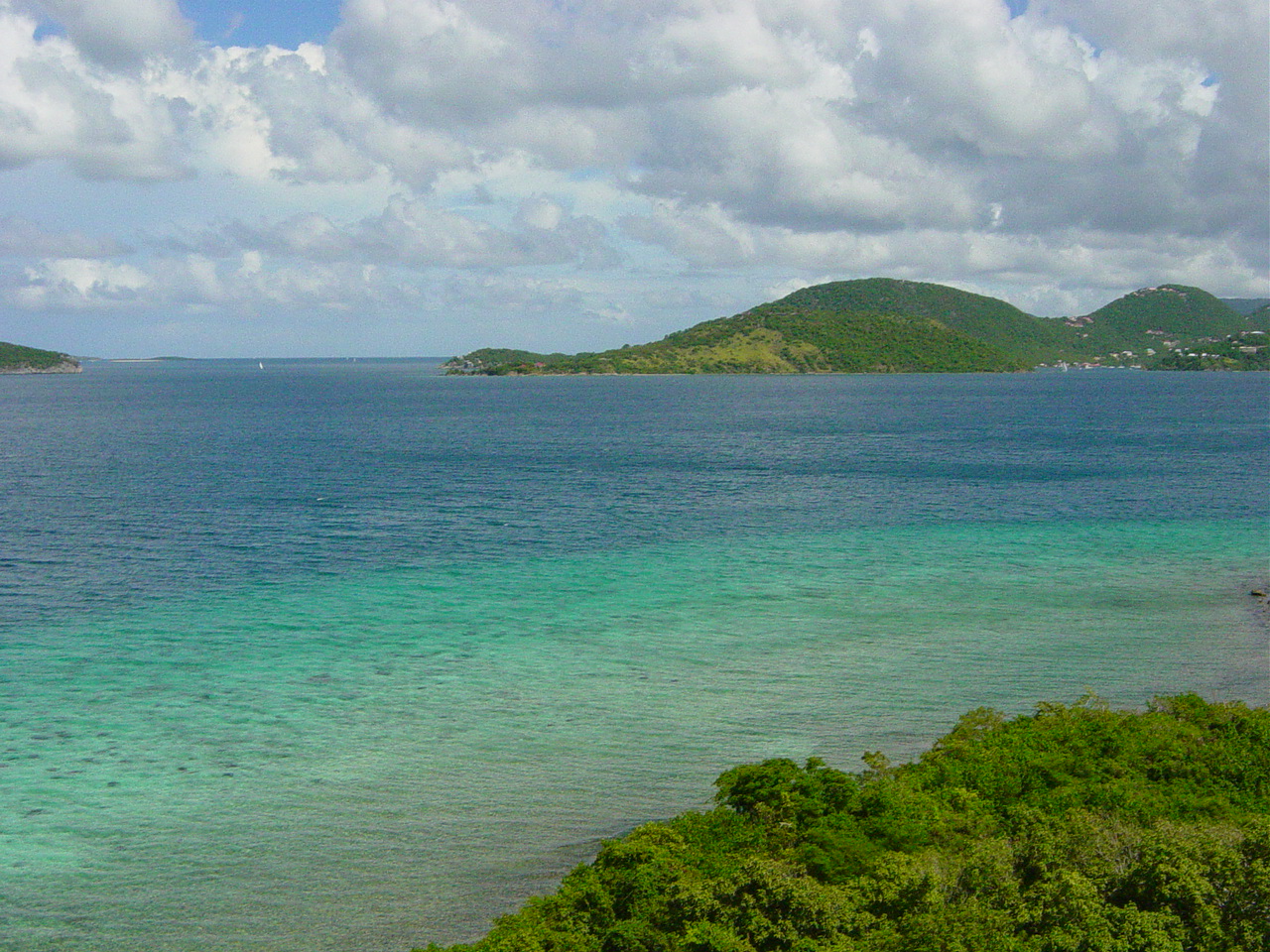 Deep blue waterway between several islands