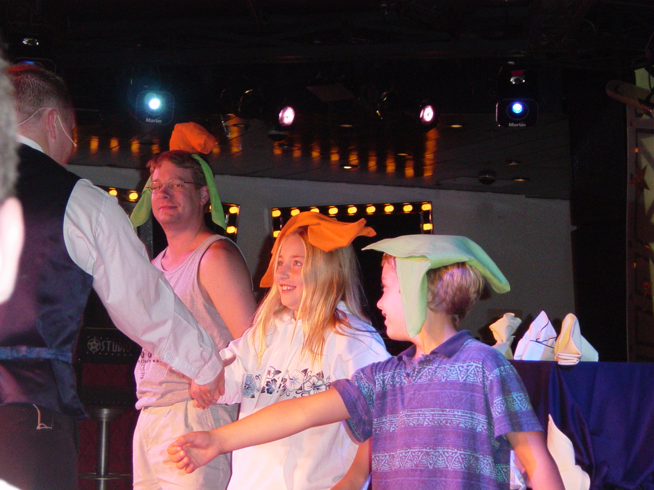 James and two children with folded napkins on their heads