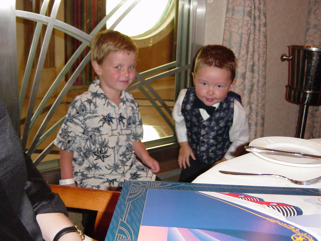 Two young boys at the dinner table