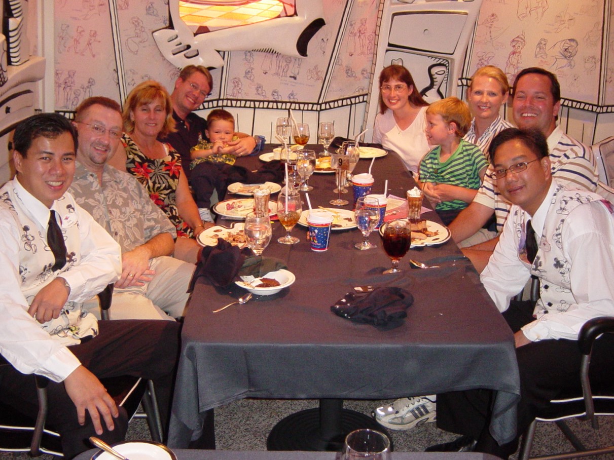 10 people sitting around a dinner table