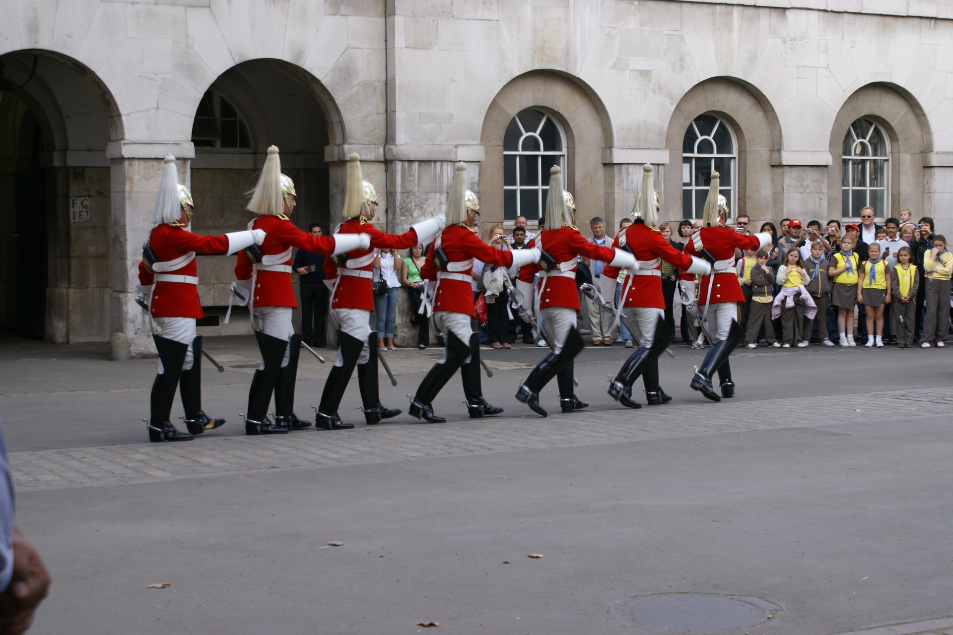 Seven Royal Guards march in a row