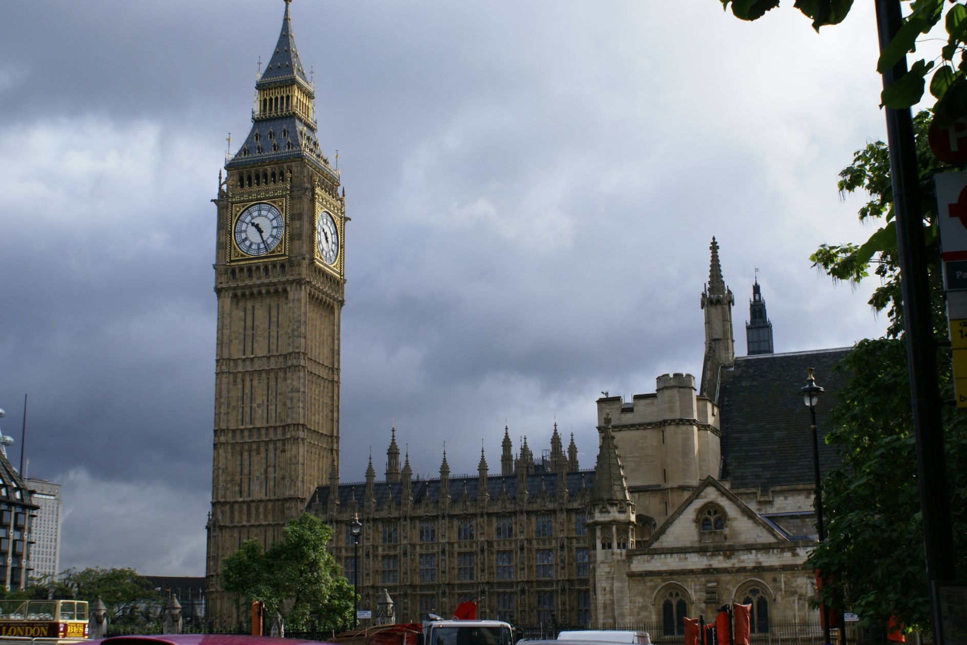 Ornate tan stone building with large clock tower