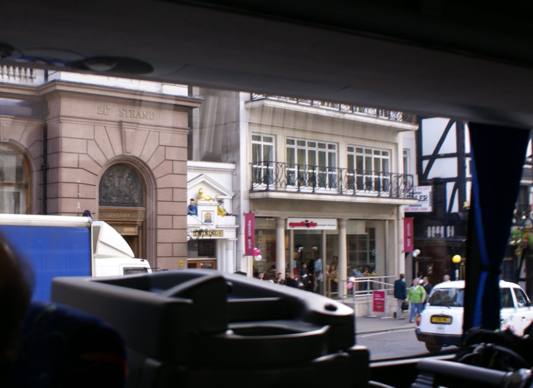 Small one-story shop between two larger buildings