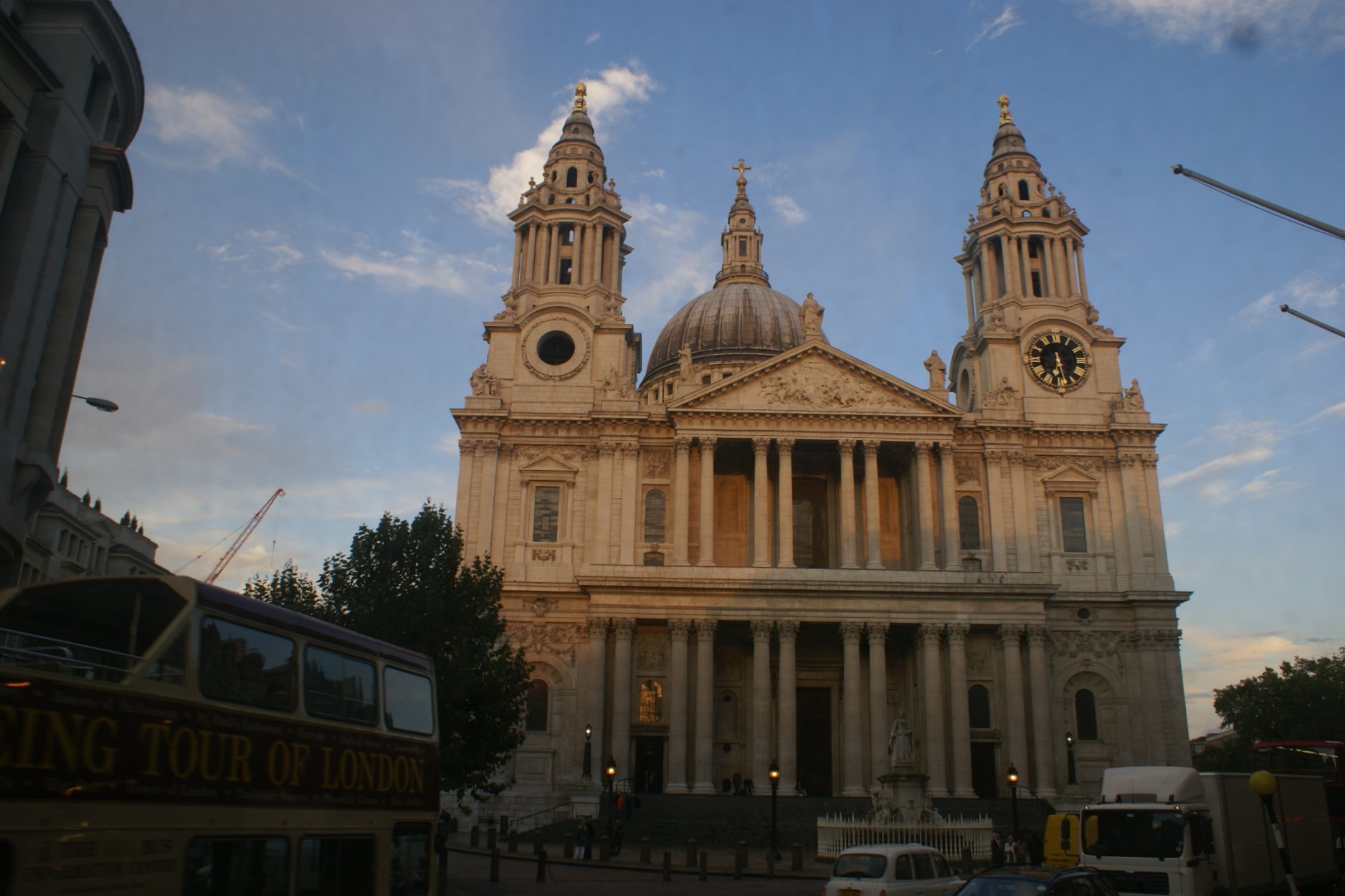 Large white stone cathedral with two bell towers and large central dome