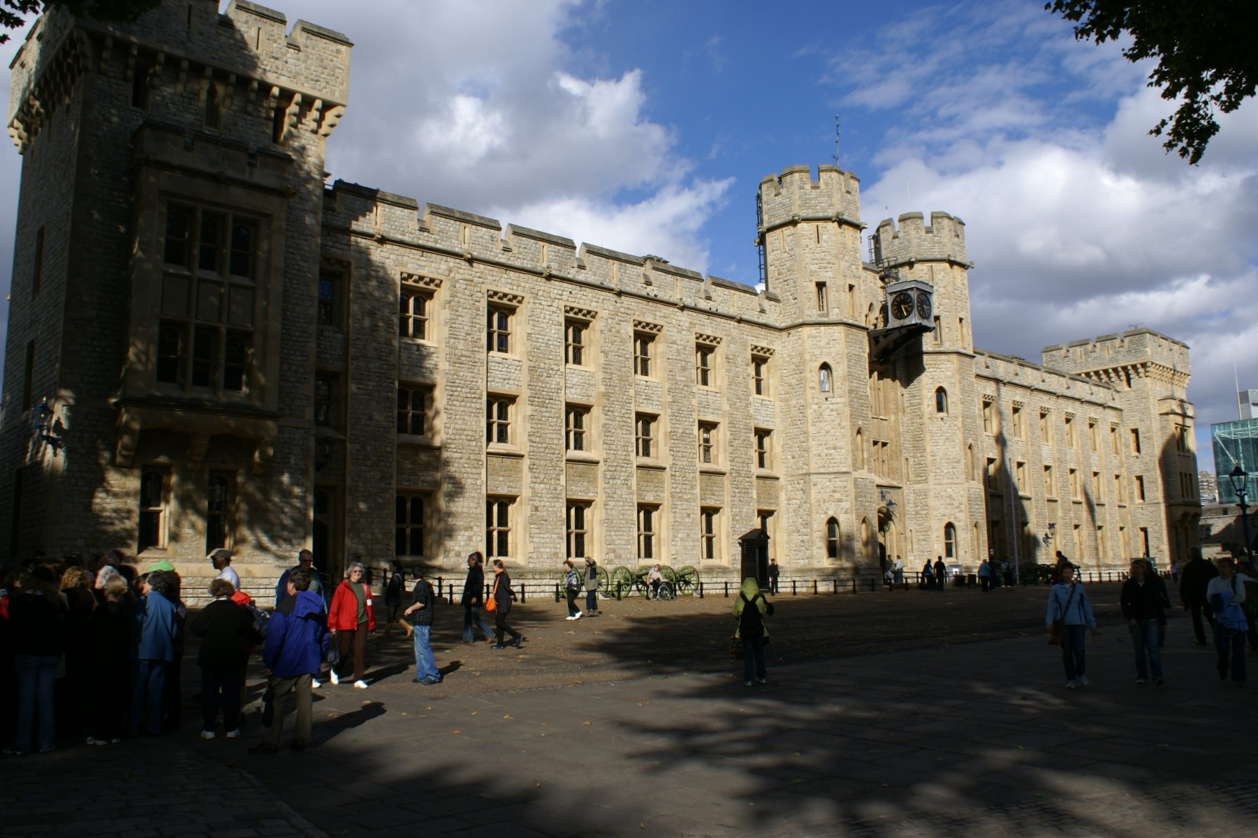 Three-story crenelated white stone building