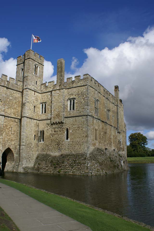 Tan stone walls extend up from a lake
