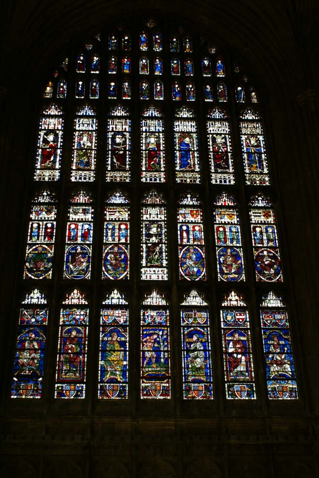 21 large stained-glass windows with 30 smaller ones infill an arched opening in the exterior wall