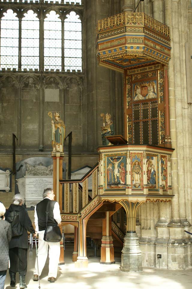 Raised platform in blue and brown towns with gold inlay where the bishop would speak to parishioners