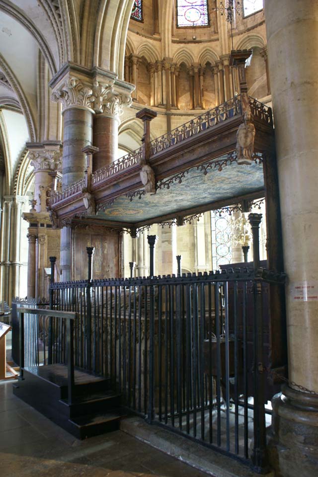Ornate sarcophagus for two below a carved and painted wood canopy