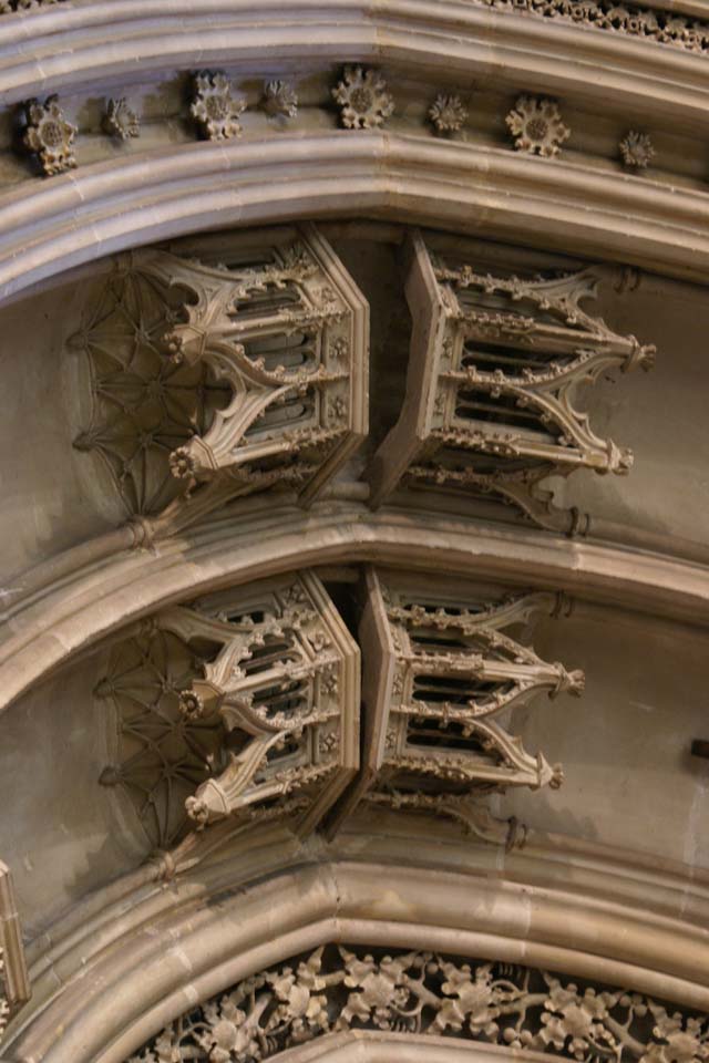 Extremely detailed stone crowns on one adorn a stone arch
