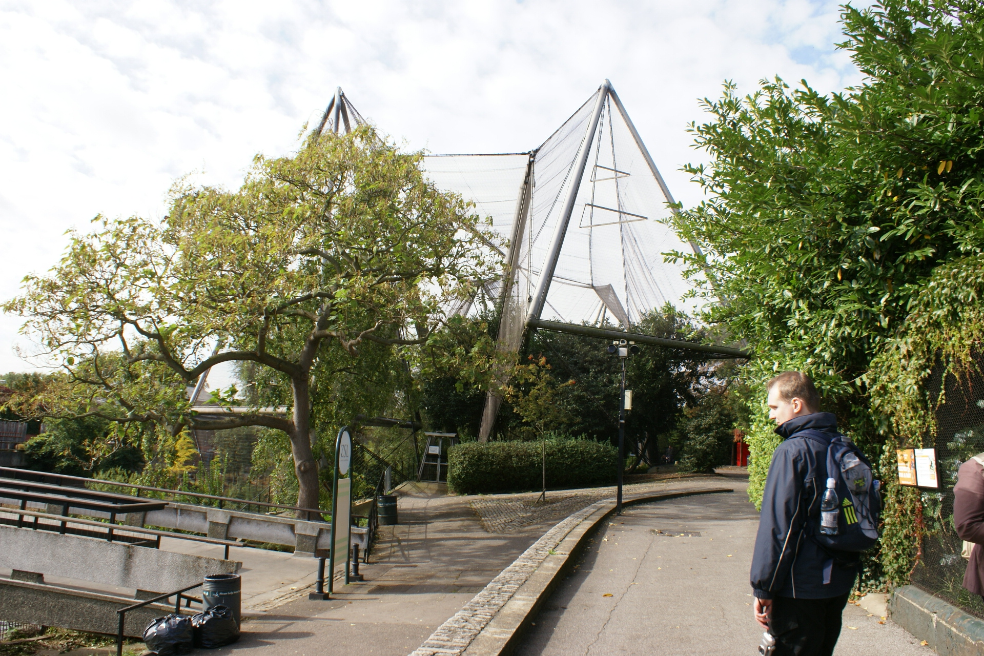 Nets supported by large steel poles form an enclosure
