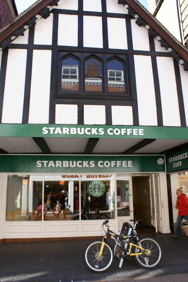 Tudor style building with a Starbucks sign