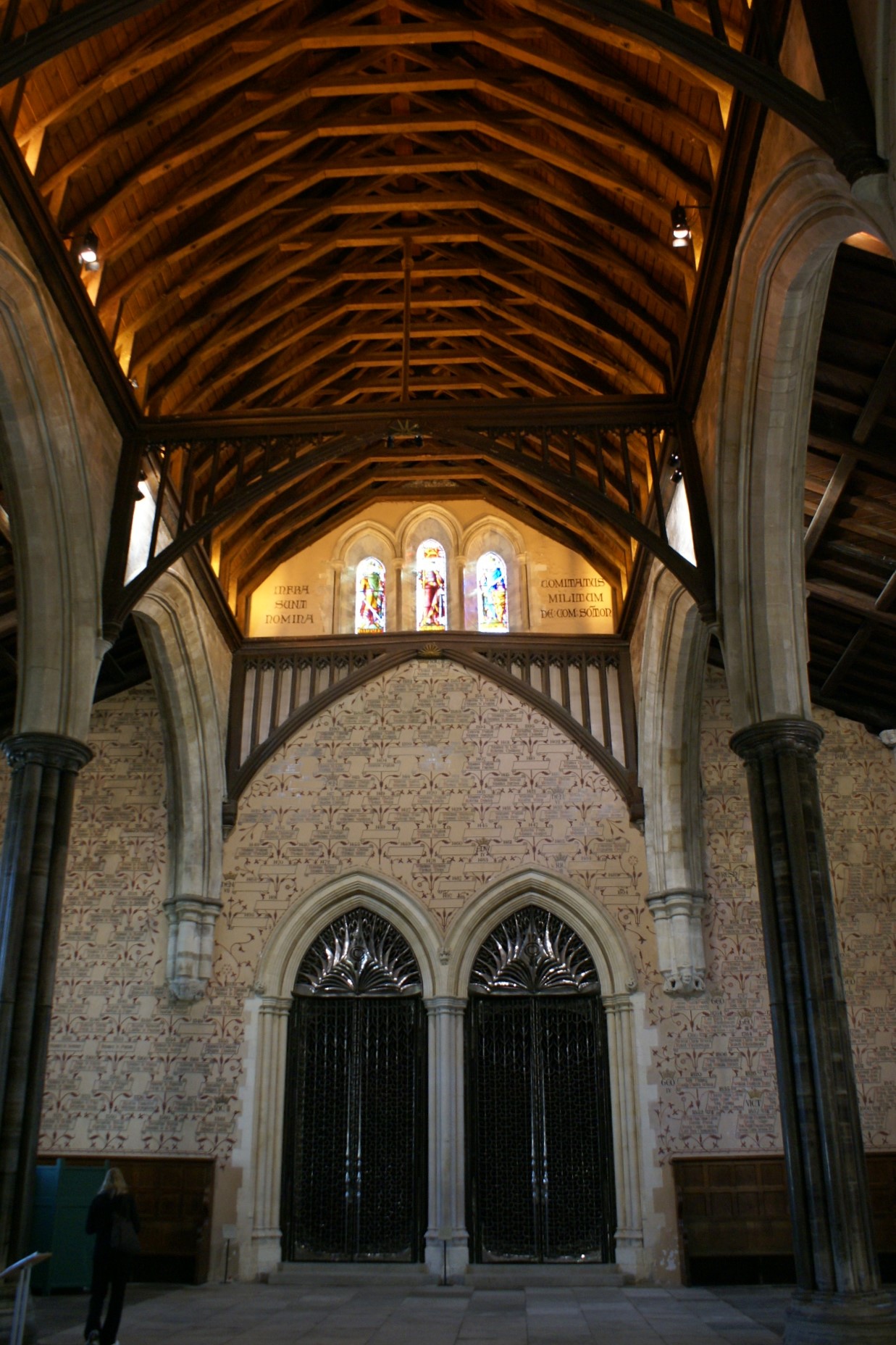 15-foot-tall stainless-steel gates stand in an ornate wall below an arched roof