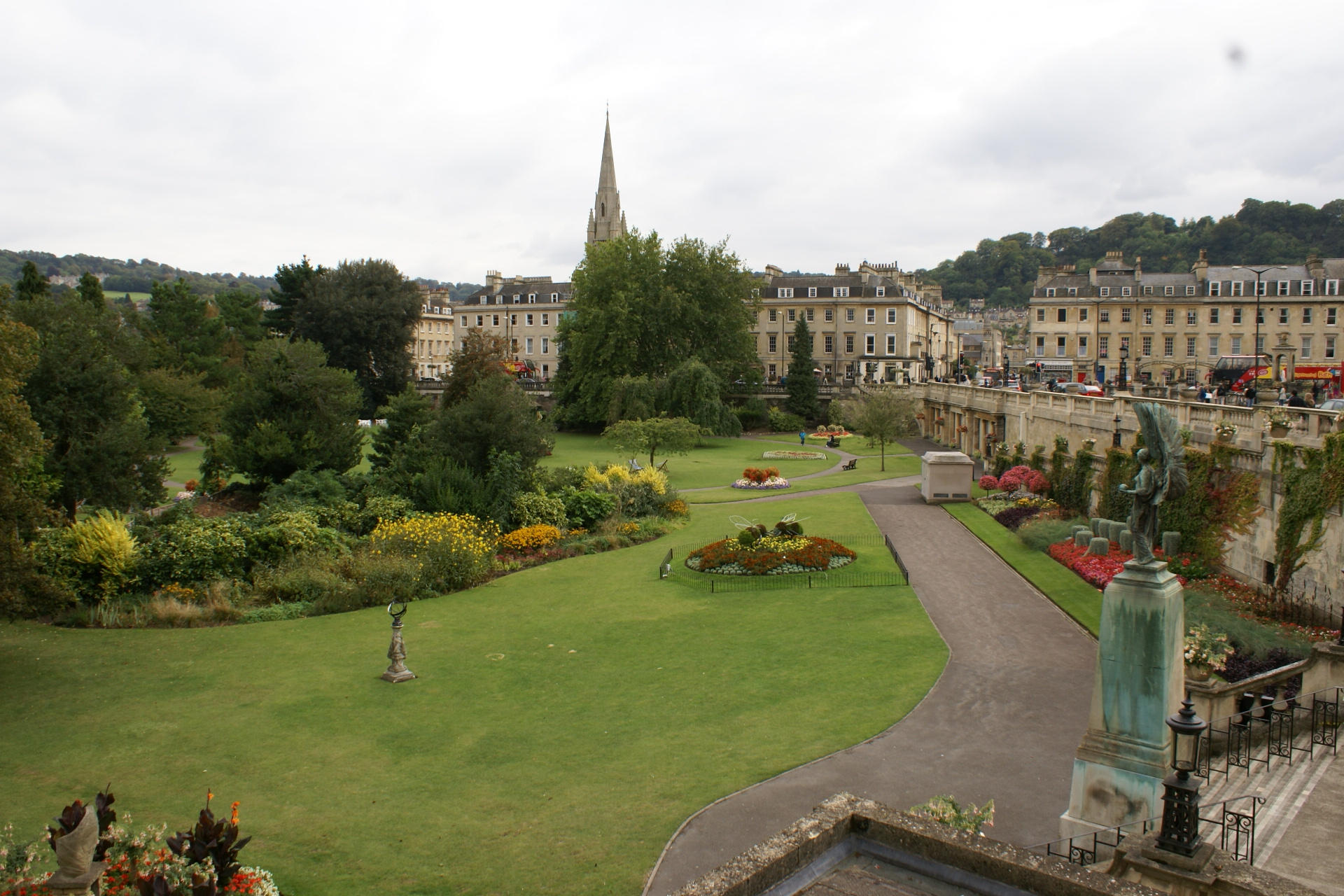 A private garden below well below street level has several manicured flower beds