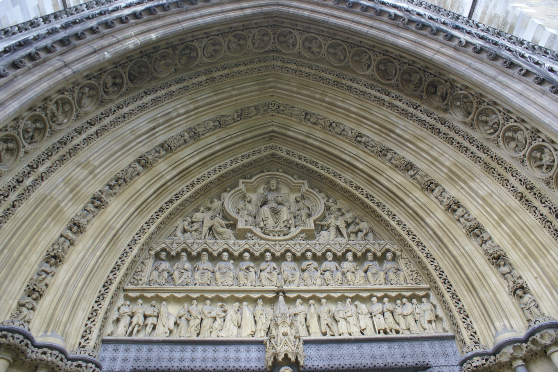 Stone carvings in a gothic style archway over a door